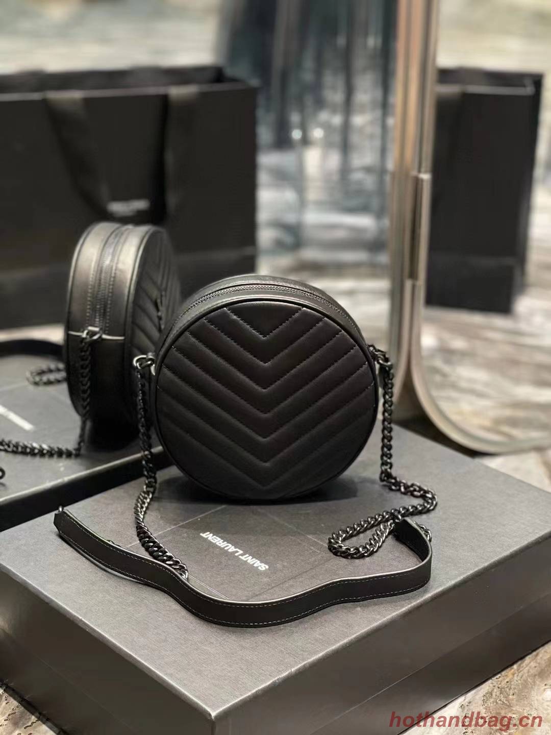 SAINT LAURENT VINYLE ROUND CAMERA BAG IN CHEVRON-QUILTED GRAIN DE POUDRE EMBOSSED LEATHER 6104361 black SAINT LAURENT VINYLE ROUND CAMERA BAG IN CHEVRON-QUILTED GRAIN DE POUDRE EMBOSSED LEATHER 6104361 black