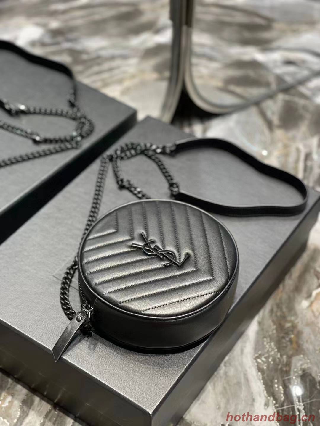 SAINT LAURENT VINYLE ROUND CAMERA BAG IN CHEVRON-QUILTED GRAIN DE POUDRE EMBOSSED LEATHER 6104361 black SAINT LAURENT VINYLE ROUND CAMERA BAG IN CHEVRON-QUILTED GRAIN DE POUDRE EMBOSSED LEATHER 6104361 black